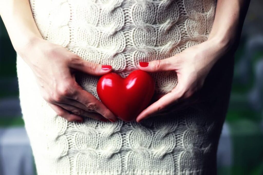 a-woman-holding-a-heart-1030x687